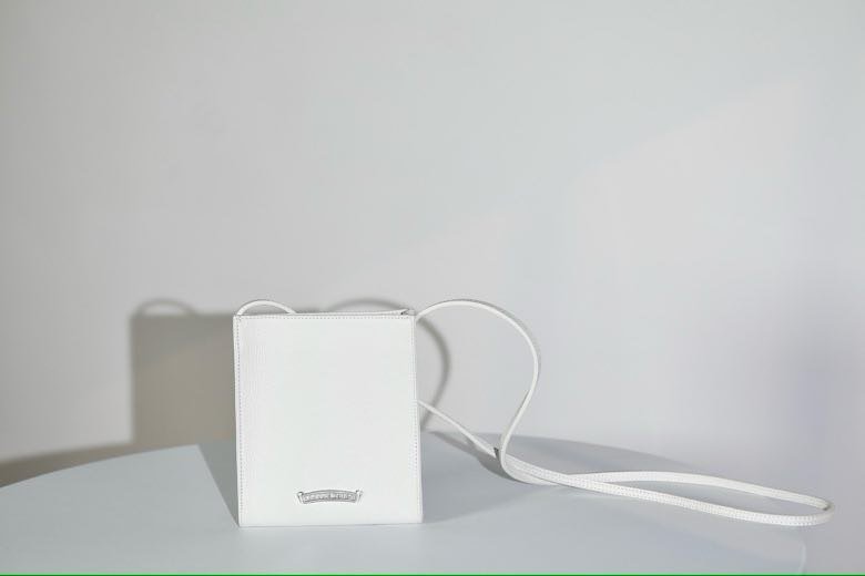 White a bag across shoulder