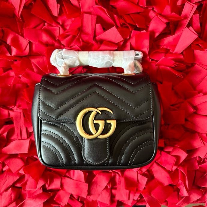 A bag mini women's GG Marmont at black skin 18 cm