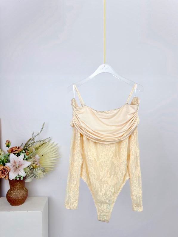 Bodysuit from drapery of lace