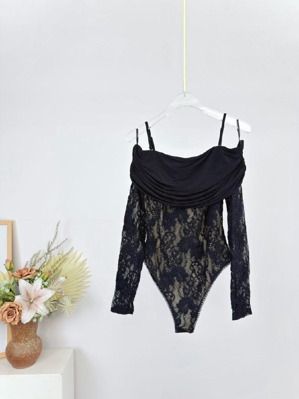Bodysuit from drapery of lace