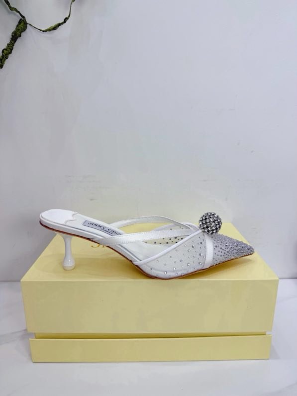 Sandals on heel from crystals and decorative ball on wear
