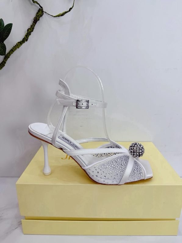 Sandals on stud from crystals and decorative ball on wear from strap on ankle