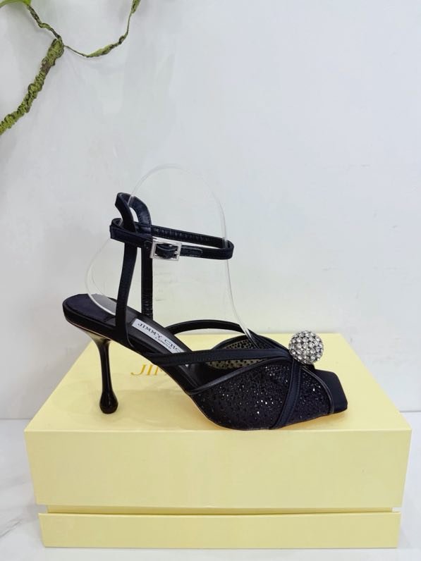 Sandals on stud from crystals and decorative ball on wear from strap on ankle