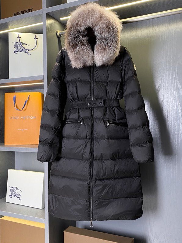 A long female Down jacket from collar of fox fur