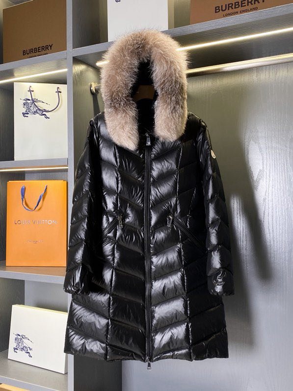 A long female Down jacket from collar of fox fur