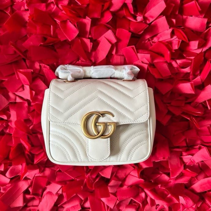 A bag mini women's GG Marmont at white skin 18 cm