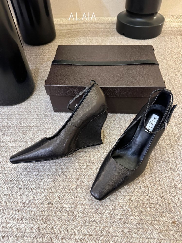 Leather shoes on Wedge from sharp the toe and strap on ankle