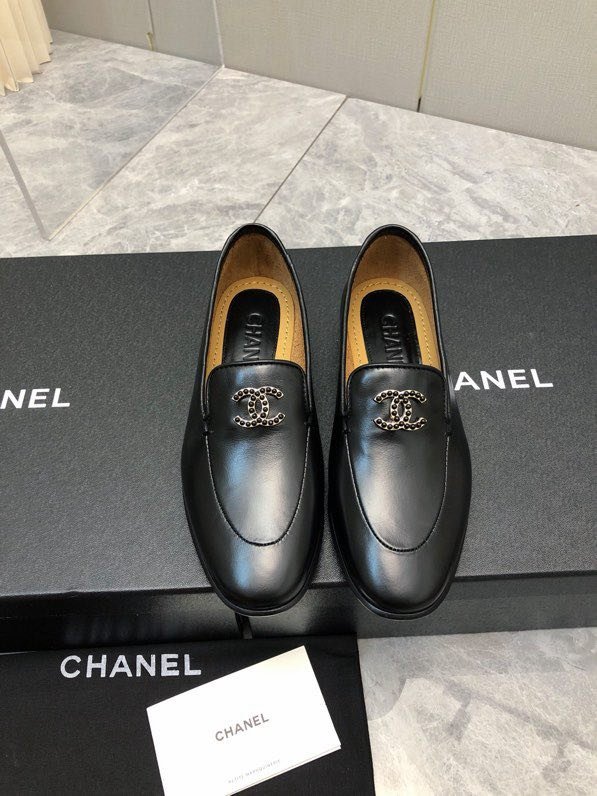 Лоферы of smooth skin from logo CC of стразов on flat soled at black color