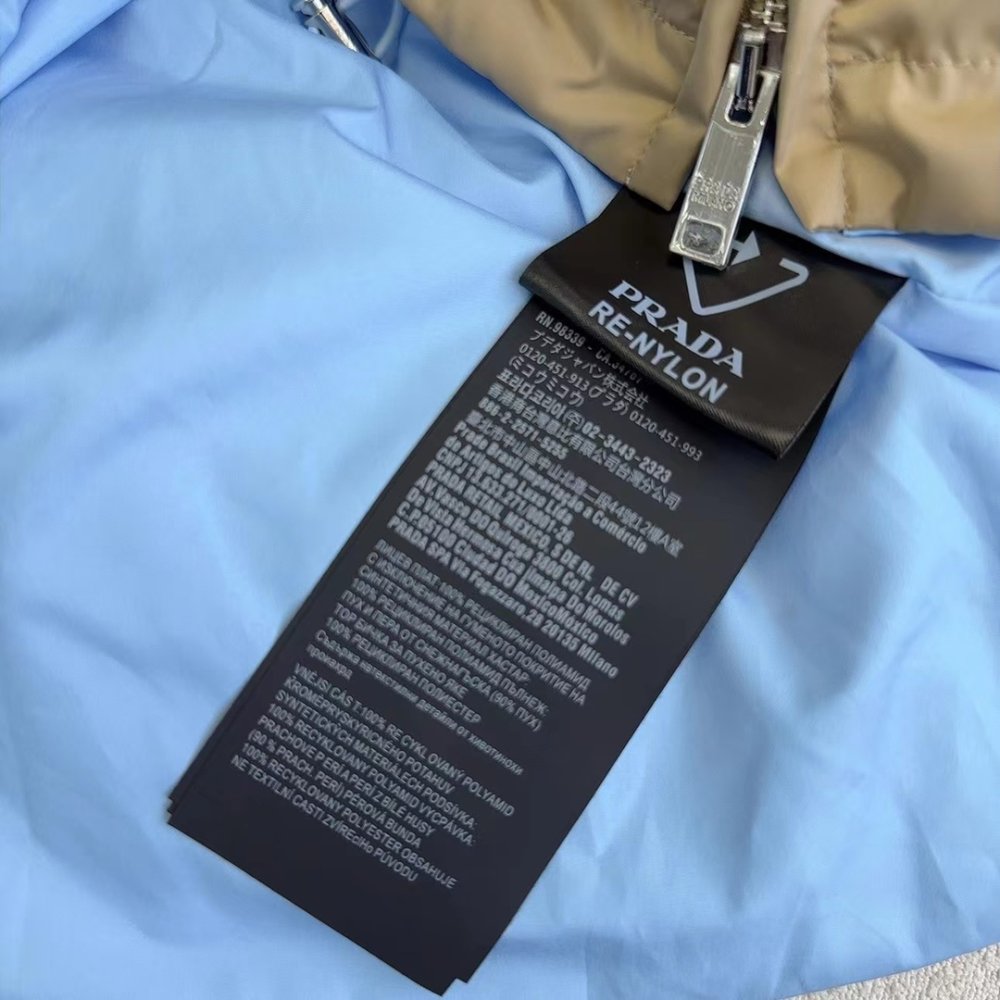 Пуховик средней длины с воротником-стойкой и поясом фото 9