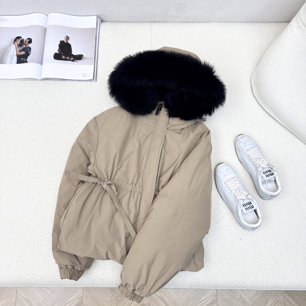 Down jacket female, collar of fur raccoon