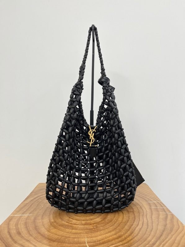A bag hobo 30 cm from weaving of wood beads