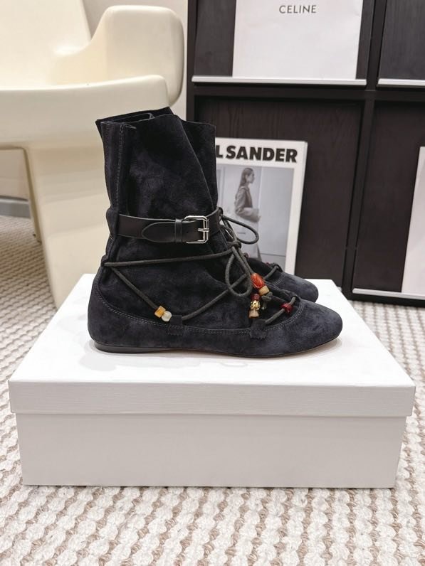 Suede boots on flat soled with lacing and decor of beads