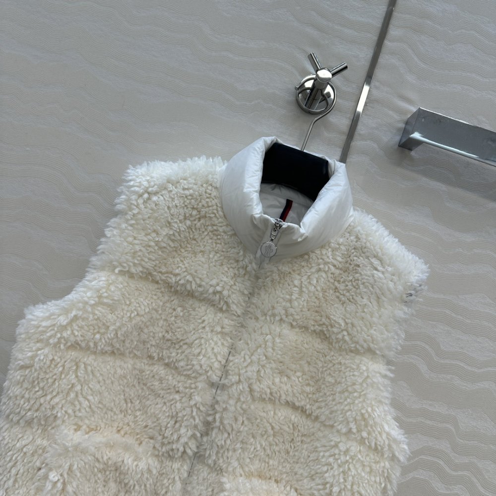 Жилетка хутряної на пуху жіноча фото 2