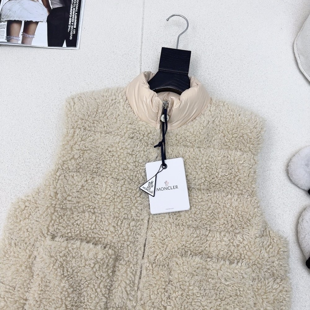 Жилетка хутряної на пуху жіноча фото 2