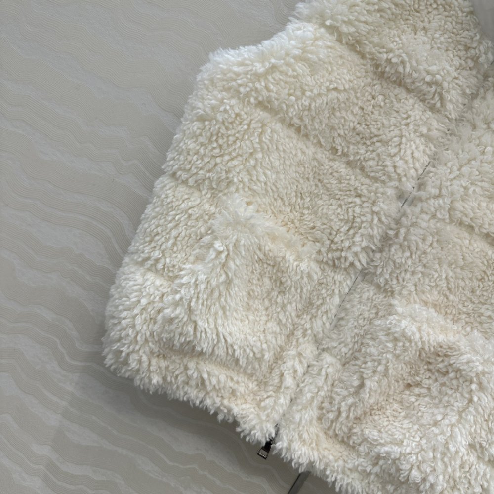 Жилетка хутряної на пуху жіноча фото 5