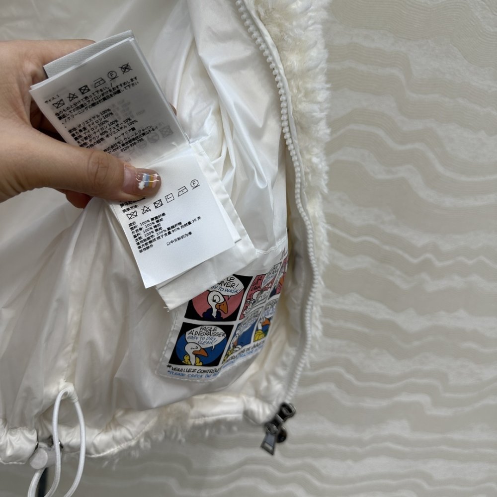 Жилетка хутряної на пуху жіноча фото 8