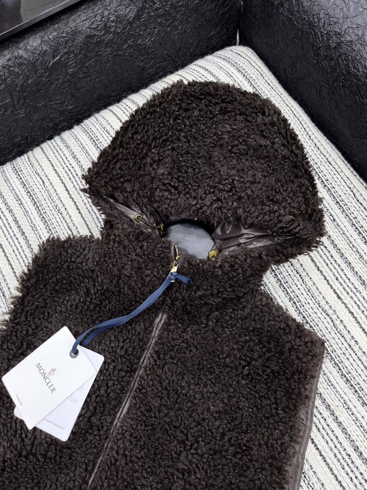 Жилетка на пуху женская фото 2