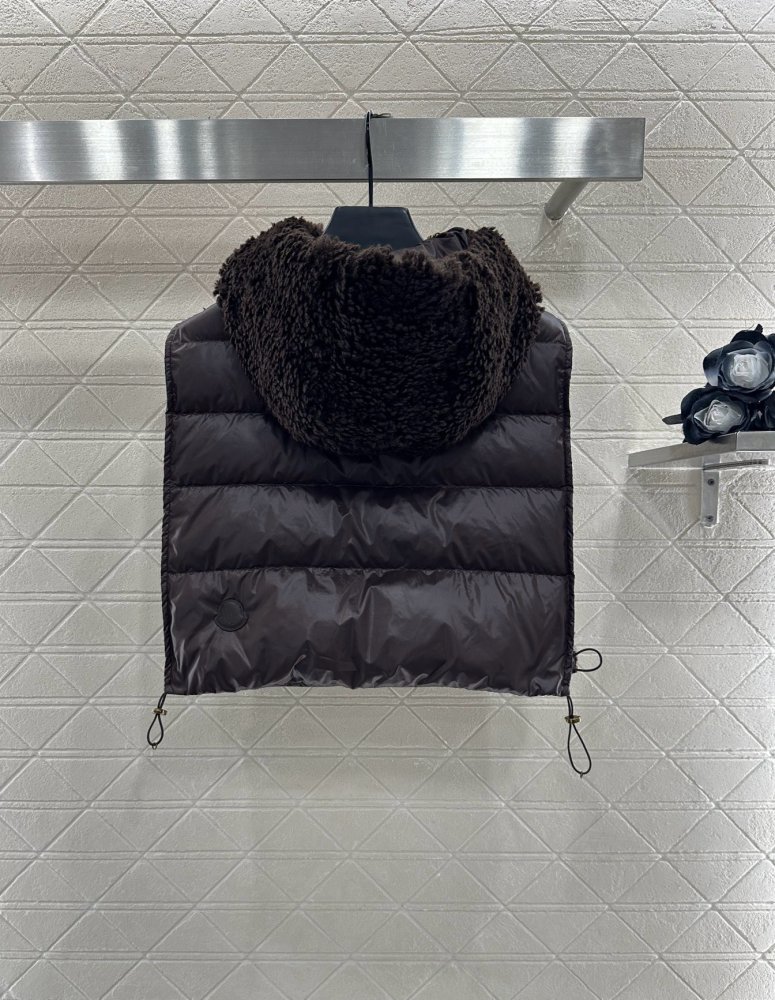 Жилетка на пуху женская фото 2