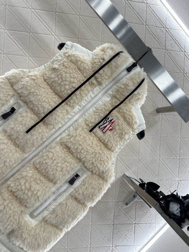 Жилетка на пуху женская фото 3