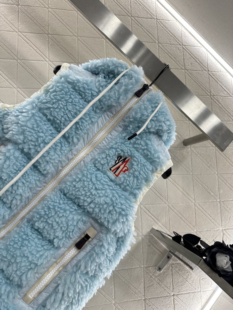 Жилетка на пуху женская фото 3