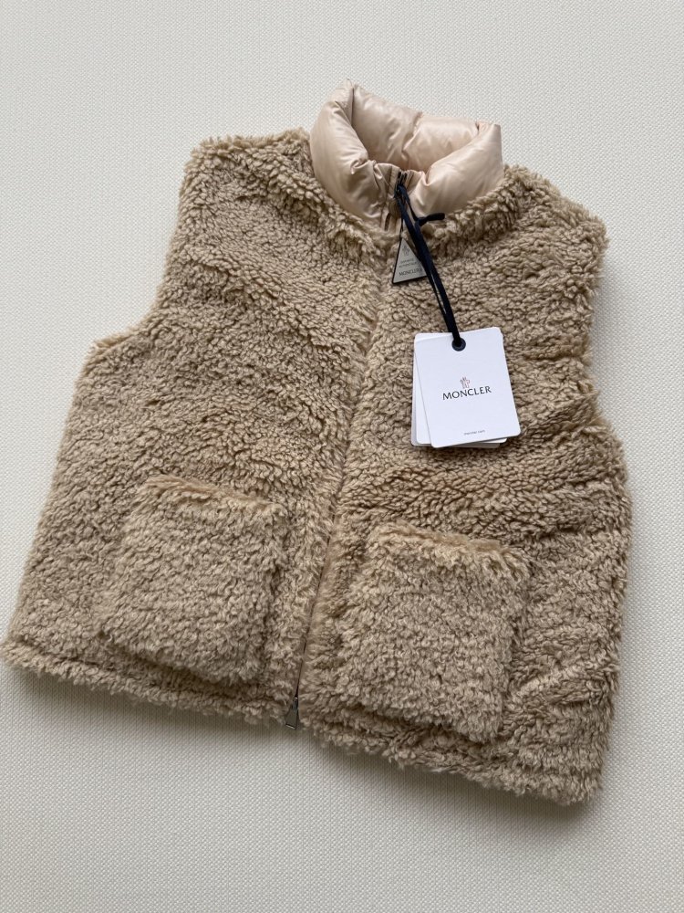 Жилетка на пуху женская фото 3