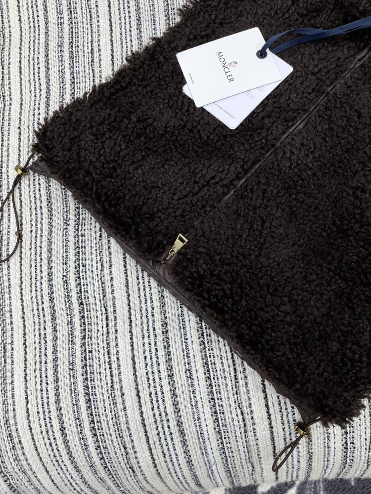 Жилетка на пуху женская фото 4