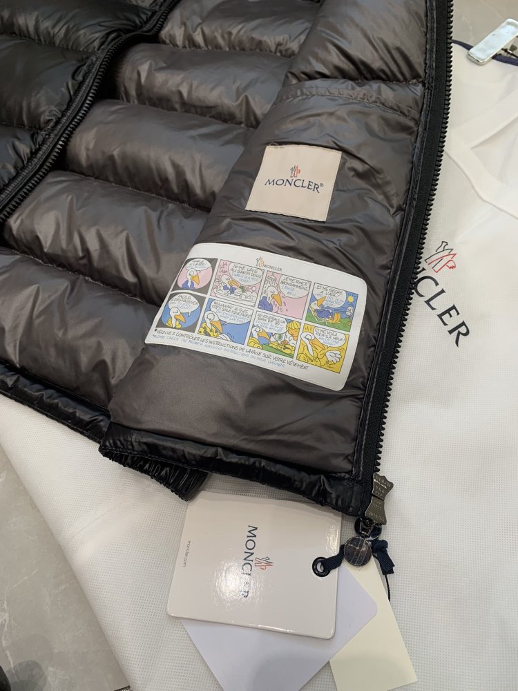 Жилетка на пуху жіноча фото 5