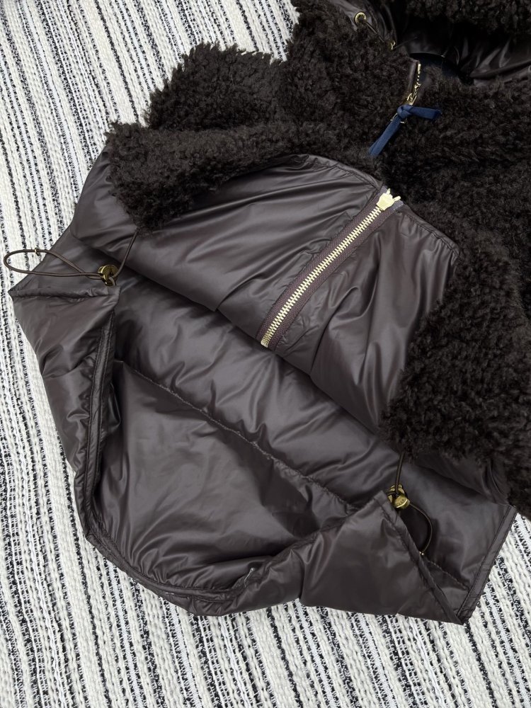 Жилетка на пуху женская фото 5