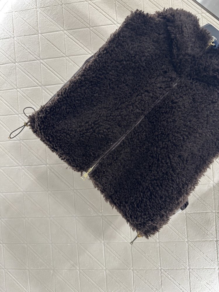 Жилетка на пуху женская фото 5