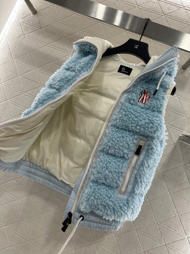 Жилетка на пуху женская фото 6