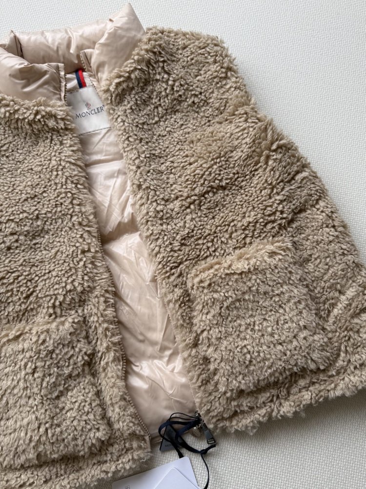 Жилетка на пуху женская фото 6