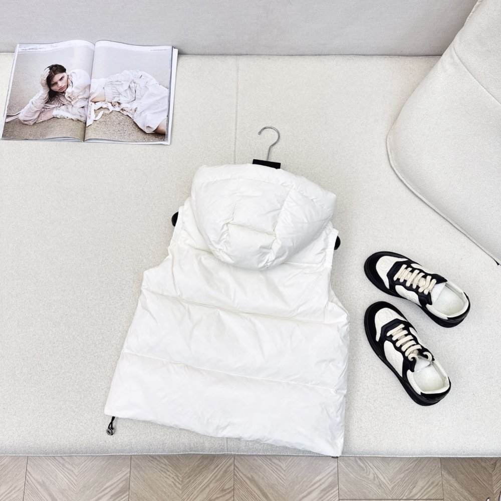 Жилетка на пуху женская фото 7