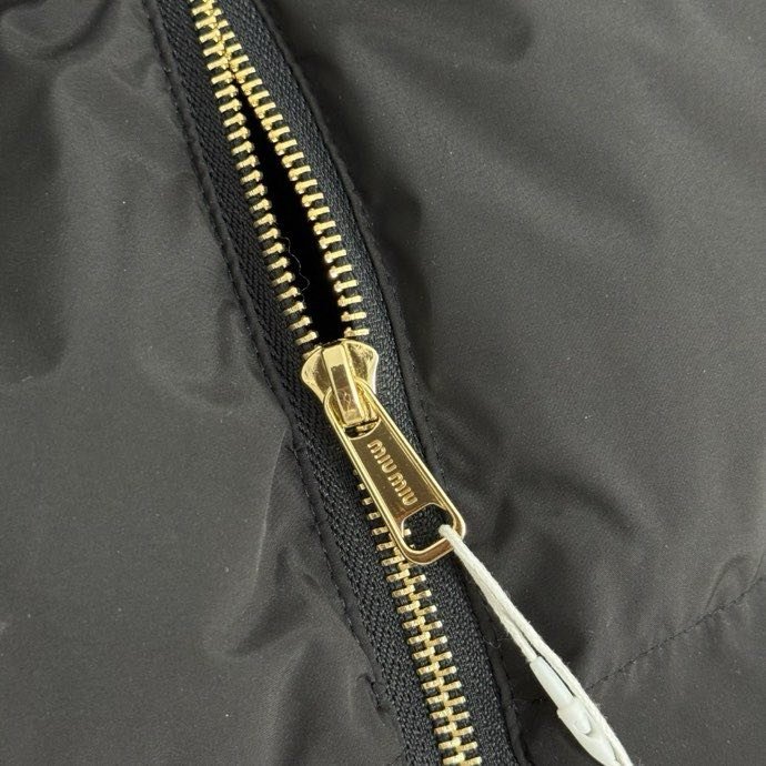 Жилетка на пуху женская фото 7