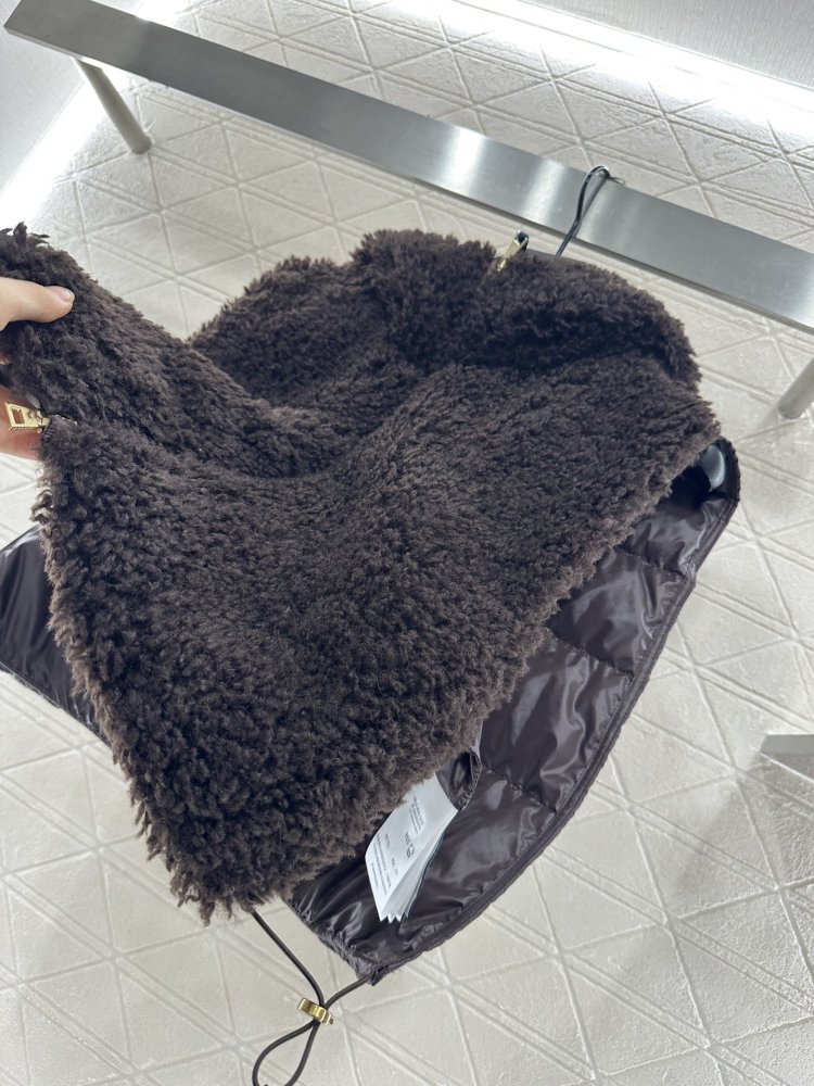 Жилетка на пуху женская фото 7