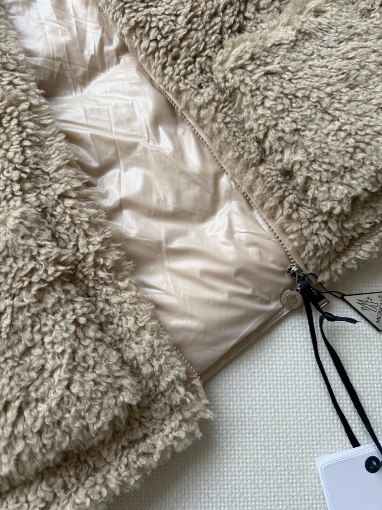 Жилетка на пуху женская фото 7