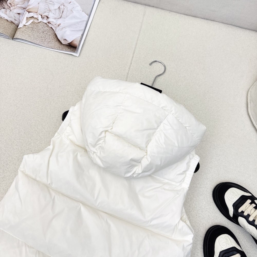 Жилетка на пуху женская фото 8